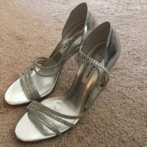 Silver high heeled shoes
